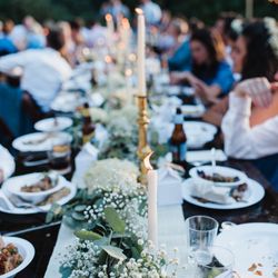 Farmer's Daughter Catering - Guests enjoying the spread by Farmer's Daughter Catering at my mountain wedding in Cashiers, NC.