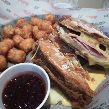 Bubba's 33 - Monte Cristo with raspberry jelly for the salty and sweet flavor with tater tots. Notice all the melted cheese on my plate. - Pizza Near Me - Aurora, Colorado