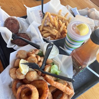 Champlin's Seafood - Overflowing Scallop Roll, onion rings, fries and Portuguese Stuffed Clams - Seafood Near Me - Narragansett, Rhode Island