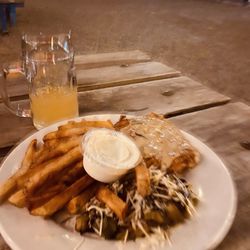 Fassler Hall Little Rock - Blurry grapefruit radler with pork schnitzel plate with Brussels sprout salad and fries