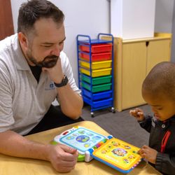 Behavior Frontiers Autism Center - A Behavior Frontiers behavior analyst works 1:1 with a child at our Riverside ABA clinic.