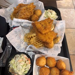 2 piece fish meal with extra purchase of sides of slaw and hushpuppes. 2 piece fish meal with extra purchase of sides of slaw and hushpuppes.