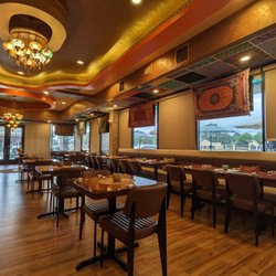 Zara’s Mediterranean Kitchen - Chandeliers and carpets from Turkey create a lovely setting