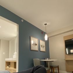 Coast Tsawwassen Inn - Living room, looking towards vanity and bedroom behind it