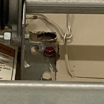 Five Star Garage Door Service - Another angle showing the bracket tearing through the unsupported drywall. Professional standards require this to be mounted to solid struct - Garage Door Services Near Me Five Star Garage Door Service - Another angle showing the bracket tearing through the unsupported drywall. Professional standards require this to be mounted to solid struct - Garage Door Services Near Me
