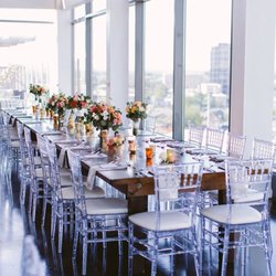 LLL Event Rentals - Estate table with crystal ice chiavari chairs with ivory cushions