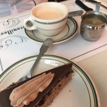Versailles - His: Chocolate cake and coffee. Chocolate cake wasn't too sweet and Hubby's café con leche was good. - Cuban Near Me - Miami, Florida Versailles - His: Chocolate cake and coffee. Chocolate cake wasn't too sweet and Hubby's café con leche was good. - Cuban Near Me - Miami, Florida