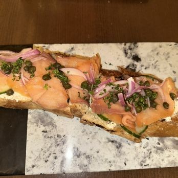 Corridor 44 - Smoked Salmon Tartine*- Herbed Boursin Cream Cheese w/Dill & English Cucumber - Champagne Bars Near Me - Denver, Colorado