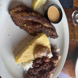 Cajun Catfish with sides of sweet butter cornbread and red beans and rice. Cajun Catfish with sides of sweet butter cornbread and red beans and rice.