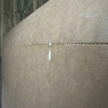 McNeese Movers - Damage done to the back of a leather chair - Movers Near Me McNeese Movers - Damage done to the back of a leather chair - Movers Near Me
