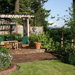 Abode On The Sea - Your own sitting area at end of your lawn with trellis & Wisterias above.