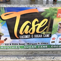 a sign for a coconut and sugar cake shop