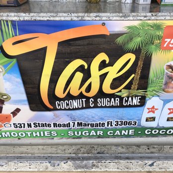 Tase - a sign for a coconut and sugar cake shop - Juice Bars & Smoothies Near Me - Margate, Florida