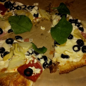 PYRO'S Fire Fresh Pizza - Alfredo, motzterlla, feta, artichokes, black olives, canadian bacon, pepperoni, and spinach. YUM! - Salad Near Me - Memphis, Tennessee