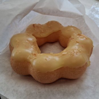 Mochii Donut - Mango coconut donut. The mochi style makes it chewier than yeast or cake donuts, which might turn some folks off - Donuts Near Me - Lombard, Illinois Mochii Donut - Mango coconut donut. The mochi style makes it chewier than yeast or cake donuts, which might turn some folks off - Donuts Near Me - Lombard, Illinois