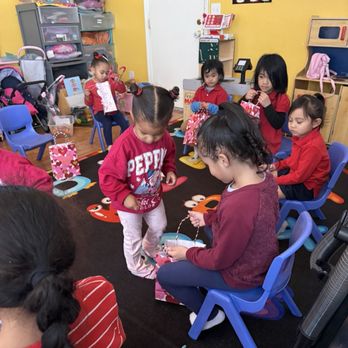 Four Corners Academy - My other twin passsing out valentines cards at the valentines party - Child Care & Day Care Near Me - Vallejo, California