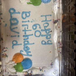 a birthday cake in a plastic container