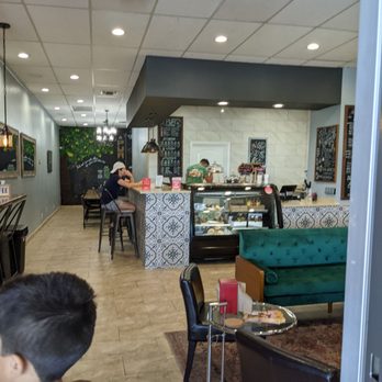 PUR Cafe Juice & Coffee West - a boy sitting at a table - Juice Bars & Smoothies Near Me - El Paso, Texas PUR Cafe Juice & Coffee West - a boy sitting at a table - Juice Bars & Smoothies Near Me - El Paso, Texas