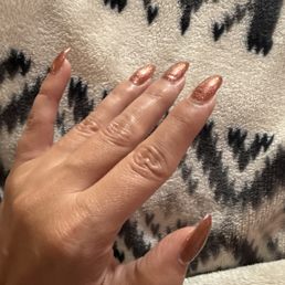 You can clearly see where my last manicure was and where the new one begins and now they are lifting It's a pretty color though You can clearly see where my last manicure was and where the new one begins and now they are lifting It's a pretty color though