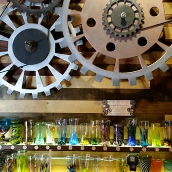 Route 30 Bottles and Brews - Intricate woodwork making these gears turn on a pulley system as a barback. - Bars Near Me - The Dalles, Oregon Route 30 Bottles and Brews - Intricate woodwork making these gears turn on a pulley system as a barback. - Bars Near Me - The Dalles, Oregon