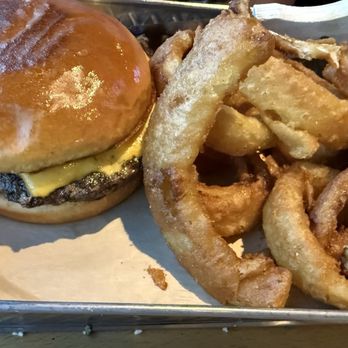 Loft18 - Classic cheeseburger (made plain) cooked medium with onion rings ... what a great crunch on those rings! - Sports Bars Near Me - Baton Rouge, Louisiana