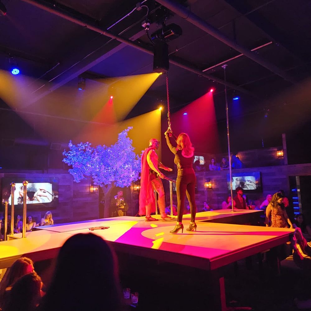The Hollywood Men - a man and a woman on stage - Strip Clubs Near Me - Anaheim, California The Hollywood Men - a man and a woman on stage - Strip Clubs Near Me - Anaheim, California