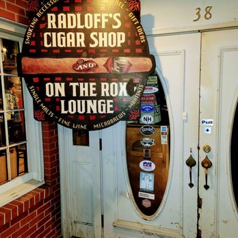 Radloff's Cigar Shop - Beautiful wooden enterance sign in a regal brick building. - Tobacco Shops Near Me - Rochester, New Hampshire Radloff's Cigar Shop - Beautiful wooden enterance sign in a regal brick building. - Tobacco Shops Near Me - Rochester, New Hampshire