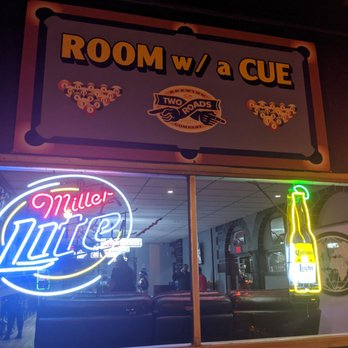 Room w/a Cue - a neon sign in the window - Sports Bars Near Me - New Britain, Connecticut Room w/a Cue - a neon sign in the window - Sports Bars Near Me - New Britain, Connecticut