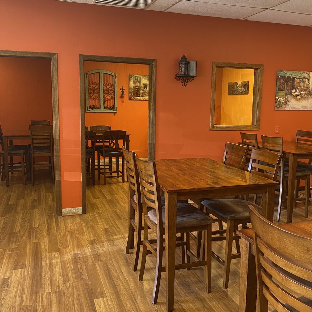 Daylight Donut Bakery - a dining room with orange walls - Donuts Near Me - Chadron, Nebraska