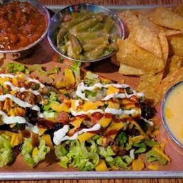 There was so much flavor on this plate!! Burnt Ends Tostada with skillet beans & queso... it's was AMAZING!! A lot of food and a must try!!