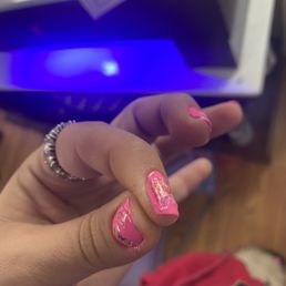 trashy stickers bc lady can't do nails. slapped on the finger and splashed with clear polish & sunken into the pink polish