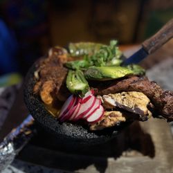 Kalaveras - steak-chicken-chorizo-queso fresco-nopal bell pepper medley-molcajete salsa-avocado-radish green onions