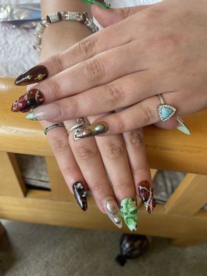 Designs - Advanced designs on extension nail services, all ranging from $15 - $25 for more advanced and intricate designs!