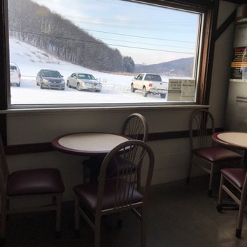 Cunningham Meats - a table and chairs in front of a window - Meat Shops Near Me - Indiana, Pennsylvania