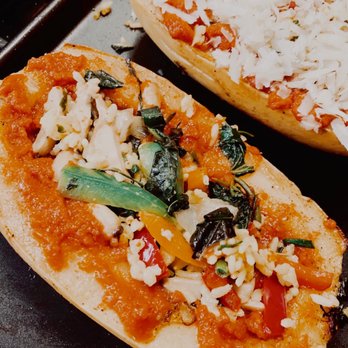 The Express - wo slices of pizza on a baking sheet - Caterers Near Me