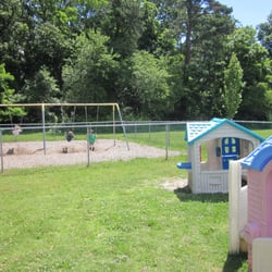 Wesley Nursery School - Swings and playhouses