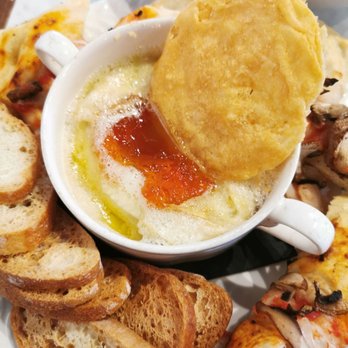 Starling - a plate of food with bread and dip - Cocktail Bars Near Me - Ottawa, Ontario