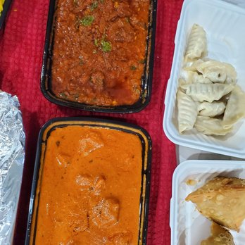 Second Wife Kitchen - Butter chicken and lamb lalmaas with momos and samosa in the back - Indian Near Me - Edmonton, Alberta Second Wife Kitchen - Butter chicken and lamb lalmaas with momos and samosa in the back - Indian Near Me - Edmonton, Alberta