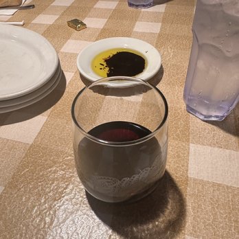 Buca di Beppo Italian Restaurant - Light pour on the wine at Buca - Italian Near Me - Encino, California