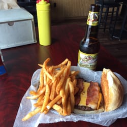 Eagle's Nest Sports Bar & Grill - Bacon cheese burger with seasoned fries ($6) and a Honey Weiss ($3.50 craft bottles).