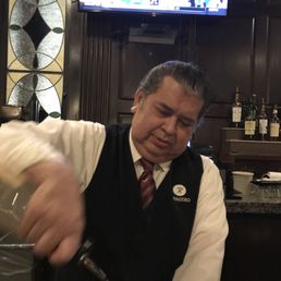 a bartender mixing a drink