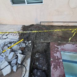 CaliBlue Pool And Spa - Digging up the plumbing.
