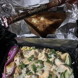 The Spice Box - Malai chicken rice bowl with naan.