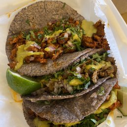 2 Pastor tacos and a carne asada taco 2 Pastor tacos and a carne asada taco