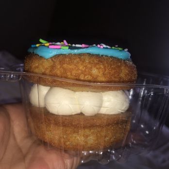 Ampersand Bakehouse - a hand holding a cupcake - Bakeries Near Me - Toronto, Ontario