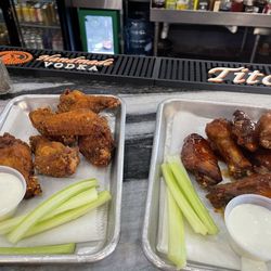 The BankBar - Whisky glazed wings on the right and dry rub on the left.