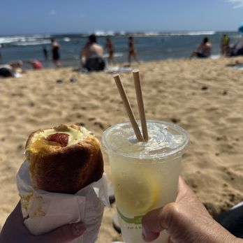 Puka Dog - Polish sausage, mild garlic lemon secret sauce, Kauai special (mango relish), lilikoi Hawaiian mustard & fresh squeezed lemonade - Hot Dogs Near Me - Koloa, Hawaii