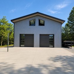OGD Overhead Garage Door - Sleek, contemporary garage doors installed on a metal building, designed for both functionality and a clean modern look.