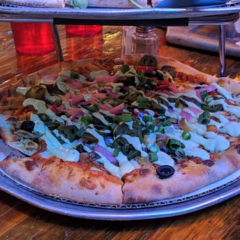 Roots Handmade Pizza - West Town - Antique Taco Pizza - Chorizo chili, cheddar curds, Chihuahua cheese, mozzarella, jalapeños, onions, avocado cream, tortilla strips, olives - Pizza Near Me - Chicago, Illinois Roots Handmade Pizza - West Town - Antique Taco Pizza - Chorizo chili, cheddar curds, Chihuahua cheese, mozzarella, jalapeños, onions, avocado cream, tortilla strips, olives - Pizza Near Me - Chicago, Illinois