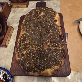 Elite Dinner: Tabac+ - ZAATAR PINSA -- Warm pinsa brushed with extra virgin olive oil, topped with zaatar herbs & toasted sesame seeds. - Yelp Events Near Me - San Diego, California